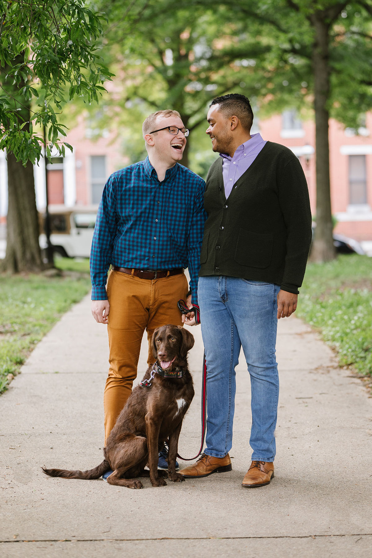 Boat rides and dog walks during loving Baltimore engagement photos two grooms dog
