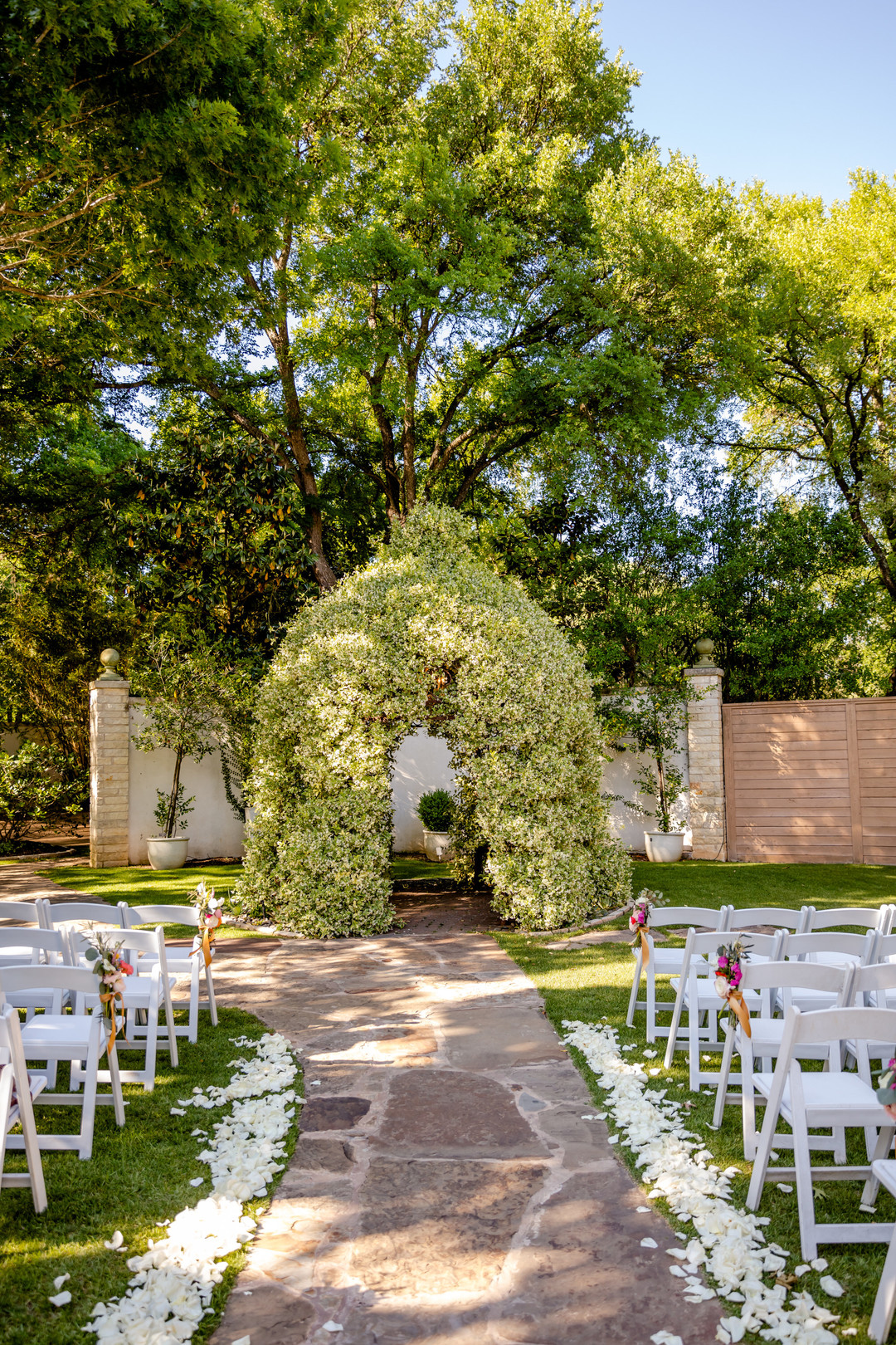Colorful, whimsical spring backyard wedding in Austin, Texas two brides white dress black tux