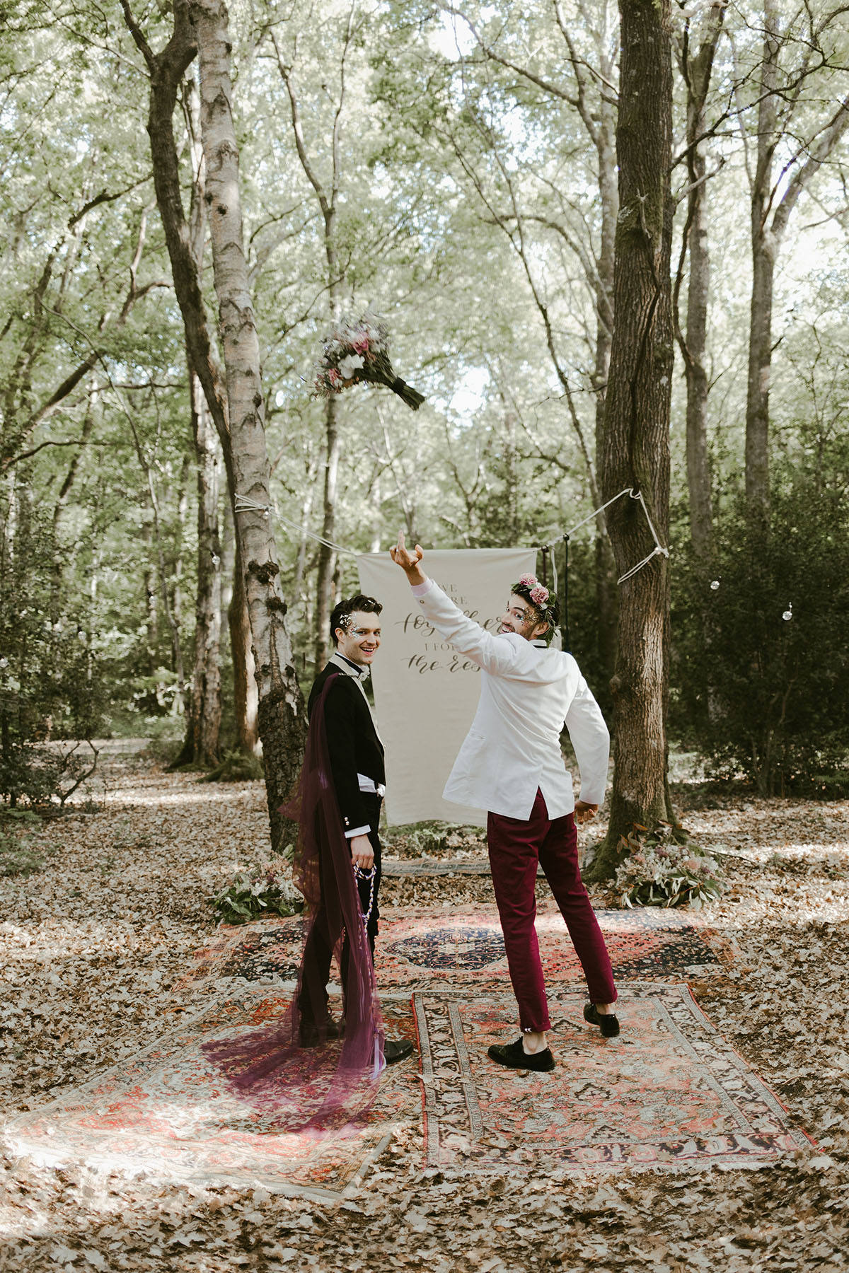 Creative wildflower elopement inspiration in the woods two grooms flowers floral veil suits creative unique styled shoot bouquet toss