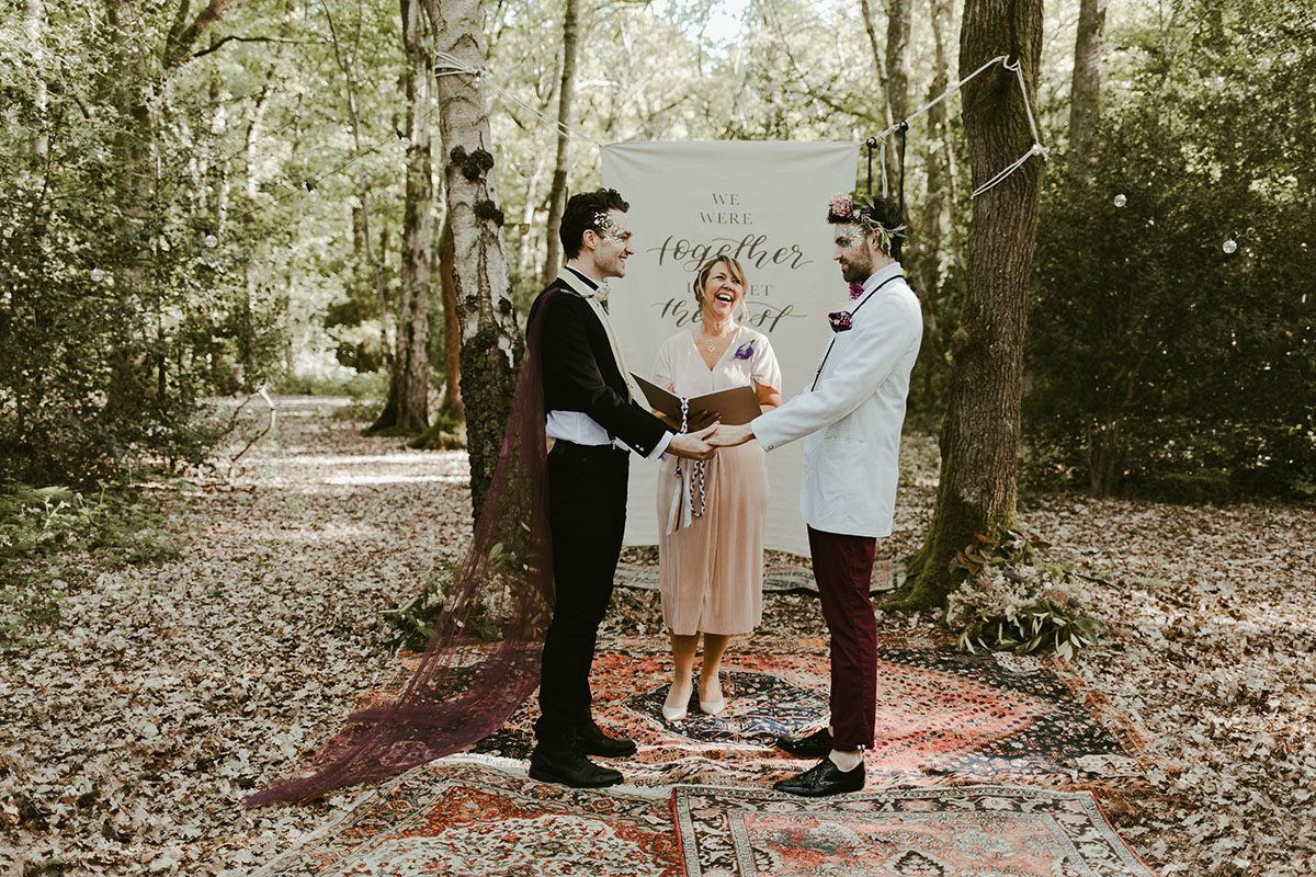Creative wildflower elopement inspiration in the woods two grooms flowers floral veil suits creative unique styled shoot vows