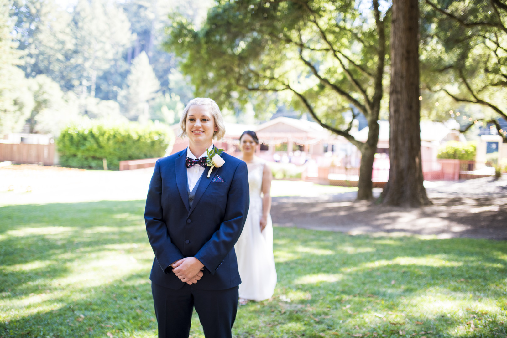 Garden wedding at the Mountain Terrace in Woodside, California two brides white dress tuxedo first look