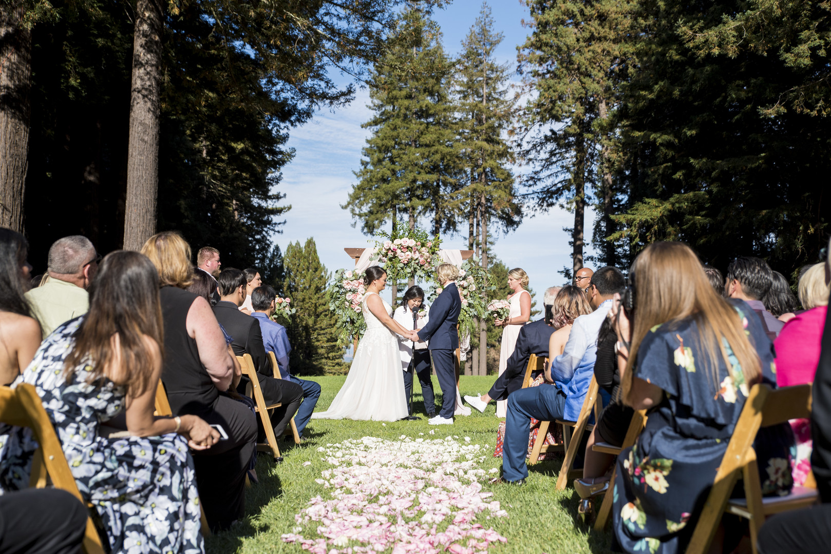 Garden wedding at the Mountain Terrace in Woodside, California two brides white dress tuxedo vows