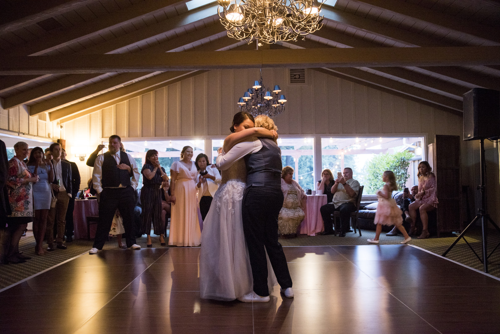 Garden wedding at the Mountain Terrace in Woodside, California two brides white dress tuxedo first dance