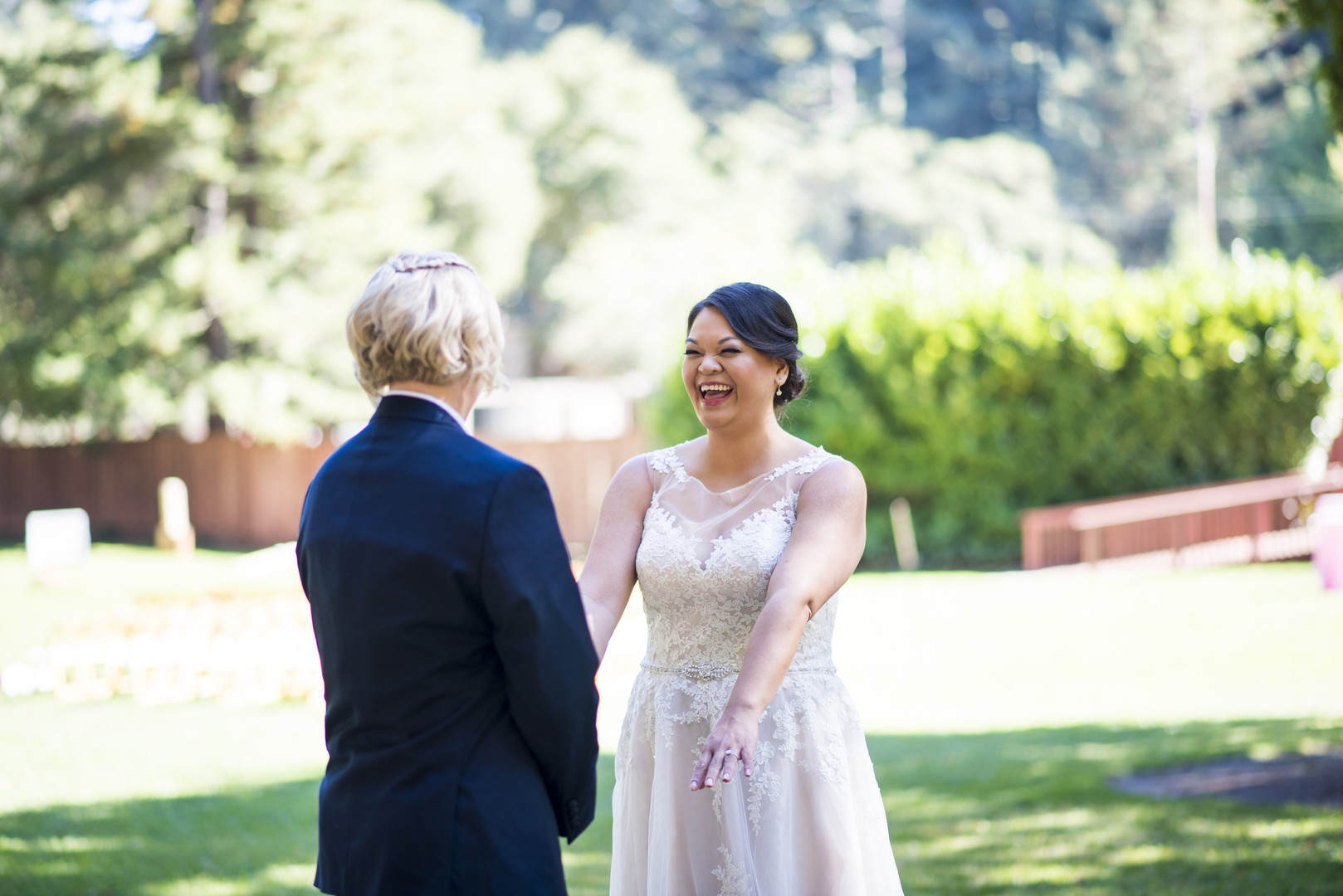 Garden wedding at the Mountain Terrace in Woodside, California two brides white dress tuxedo first look