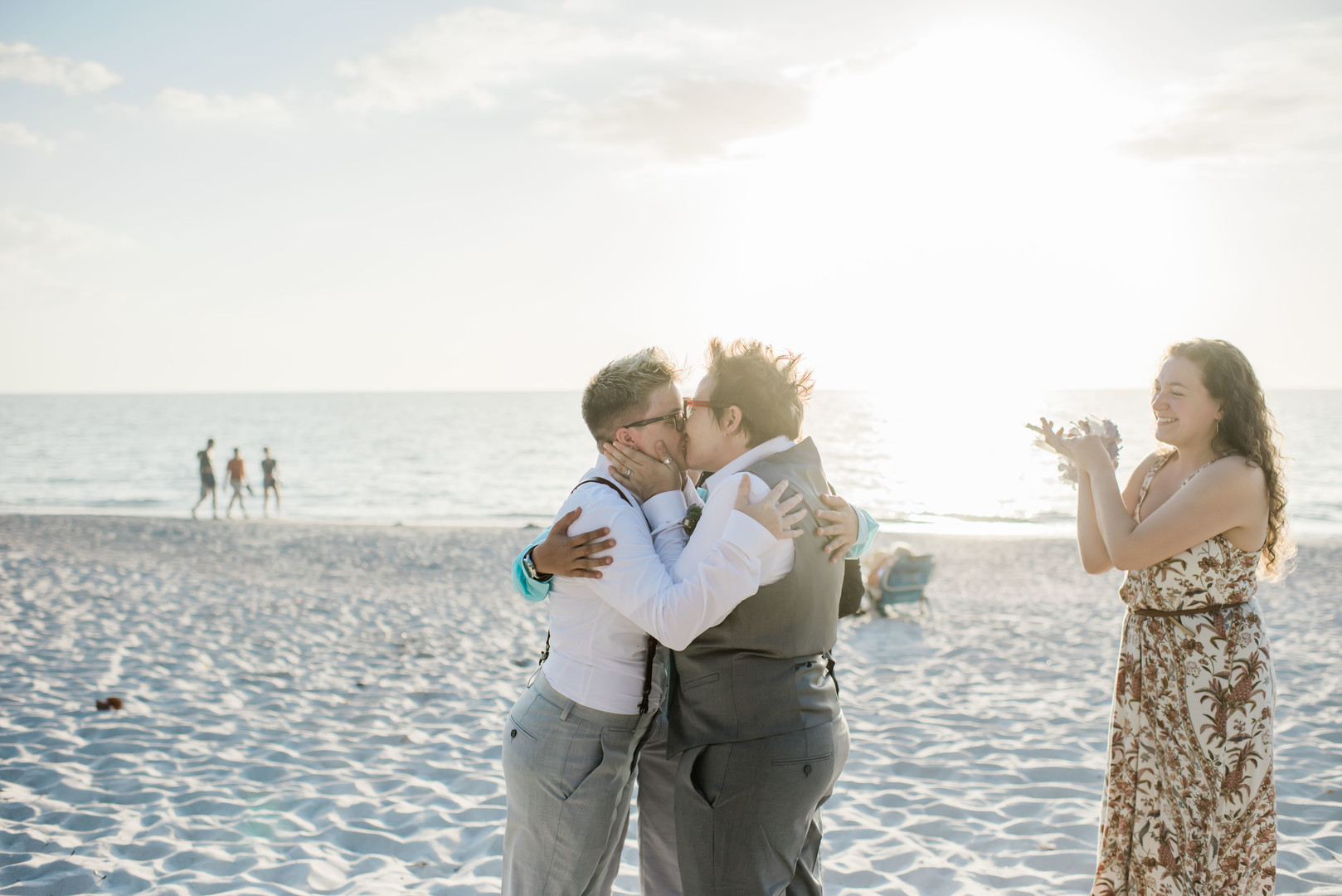 Intimate spring beach elopement in Naples, Florida small lesbian two brides casual romantic sunset kiss