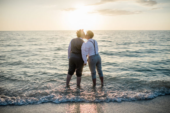 Intimate spring beach elopement in Naples, Florida small lesbian two brides casual romantic sunset kiss