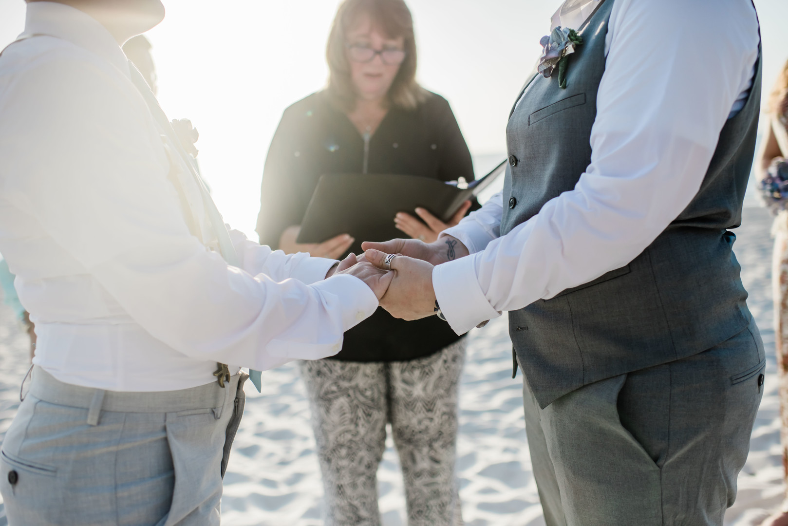Intimate spring beach elopement in Naples, Florida small lesbian two brides casual romantic sunset vows