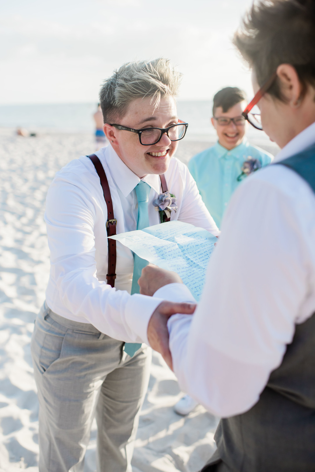 Intimate spring beach elopement in Naples, Florida small lesbian two brides casual romantic sunset vows