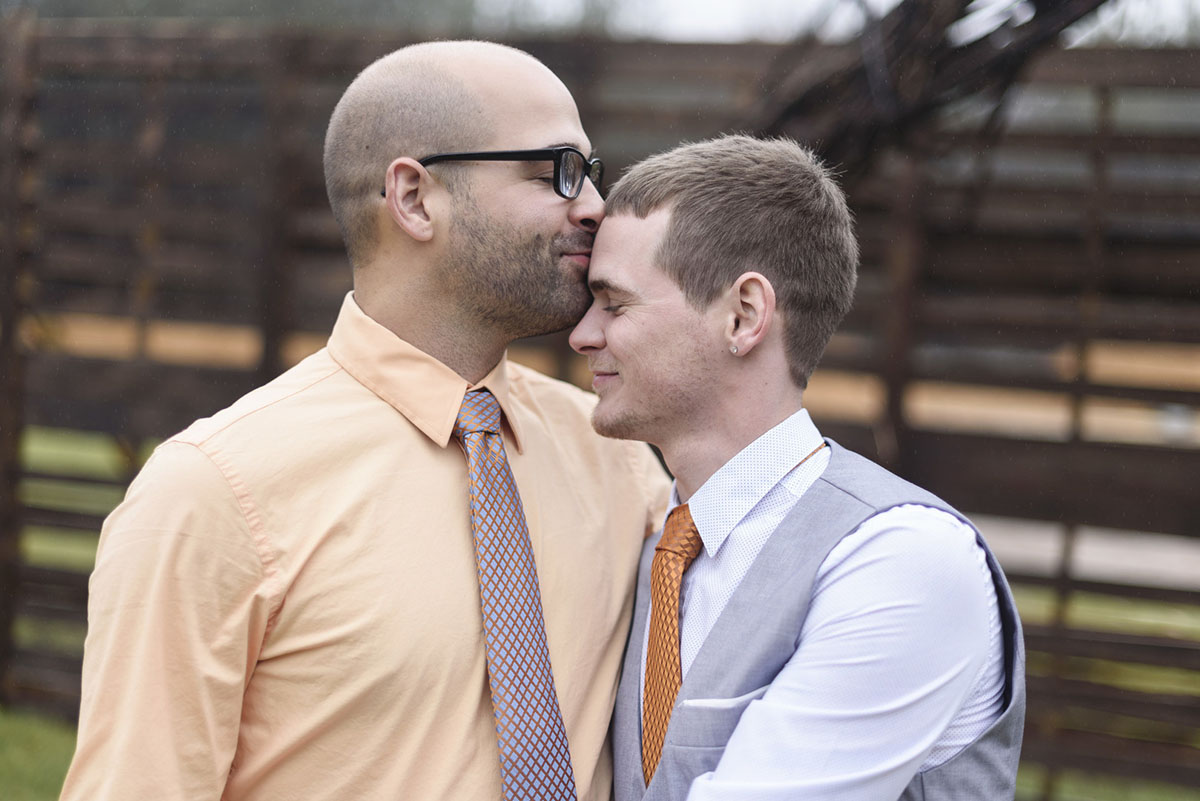 Orange winter elopement inspiration two grooms February wedding forehead kiss