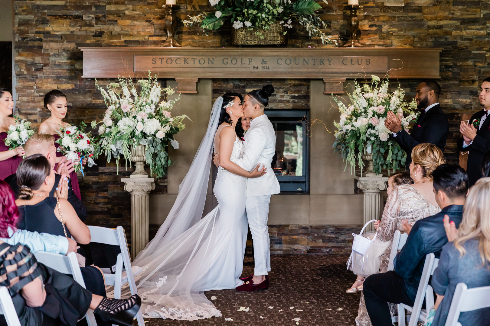 Spring country club wedding in Stockton, California two brides white tux white dress kiss vows