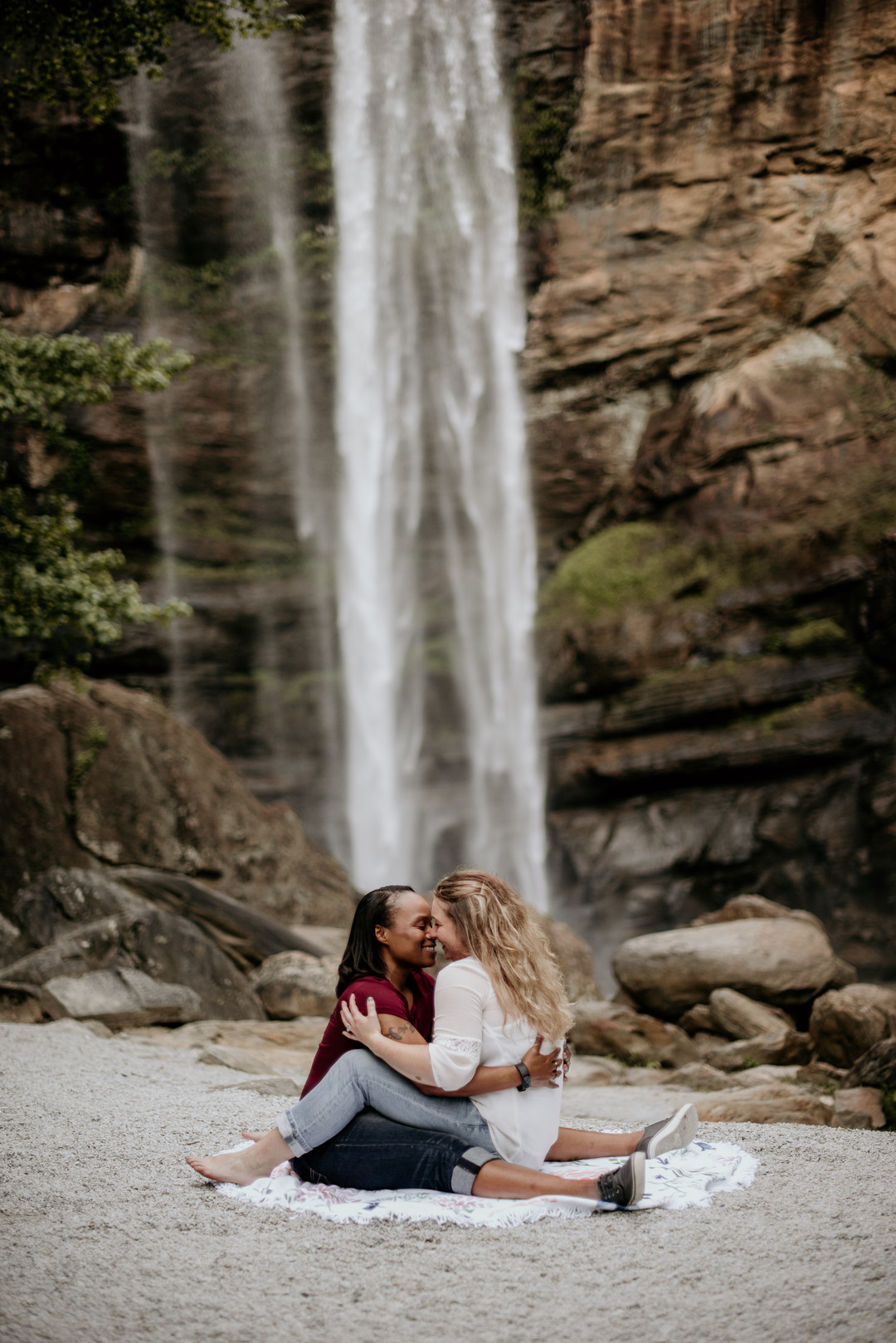 Waterfall adventure engagement photos at Toccoa Falls two brides fun picnic