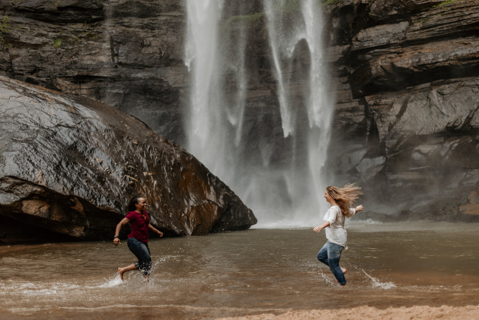 Waterfall adventure engagement photos at Toccoa Falls two brides fun run