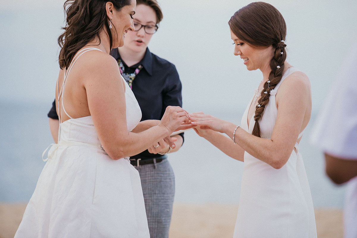 Beach wedding at First Landing State Park in Virginia Beach, Virginia LGBTQ+ weddings lesbian wedding two brides beach ocean fall wedding vows