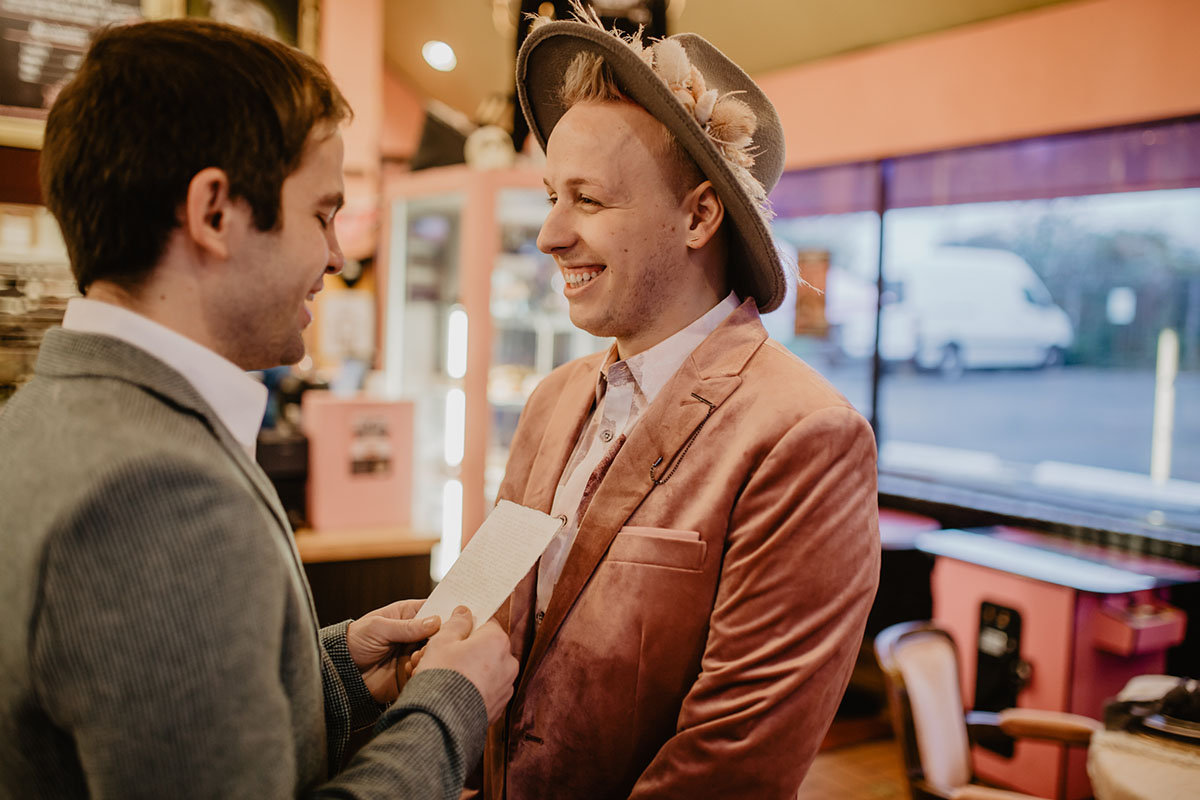 Bohemian hipster elopement inspiration at Voodoo Doughnut LGBTQ+ weddings two grooms rose gold pink cream teal Portland Oregon vows