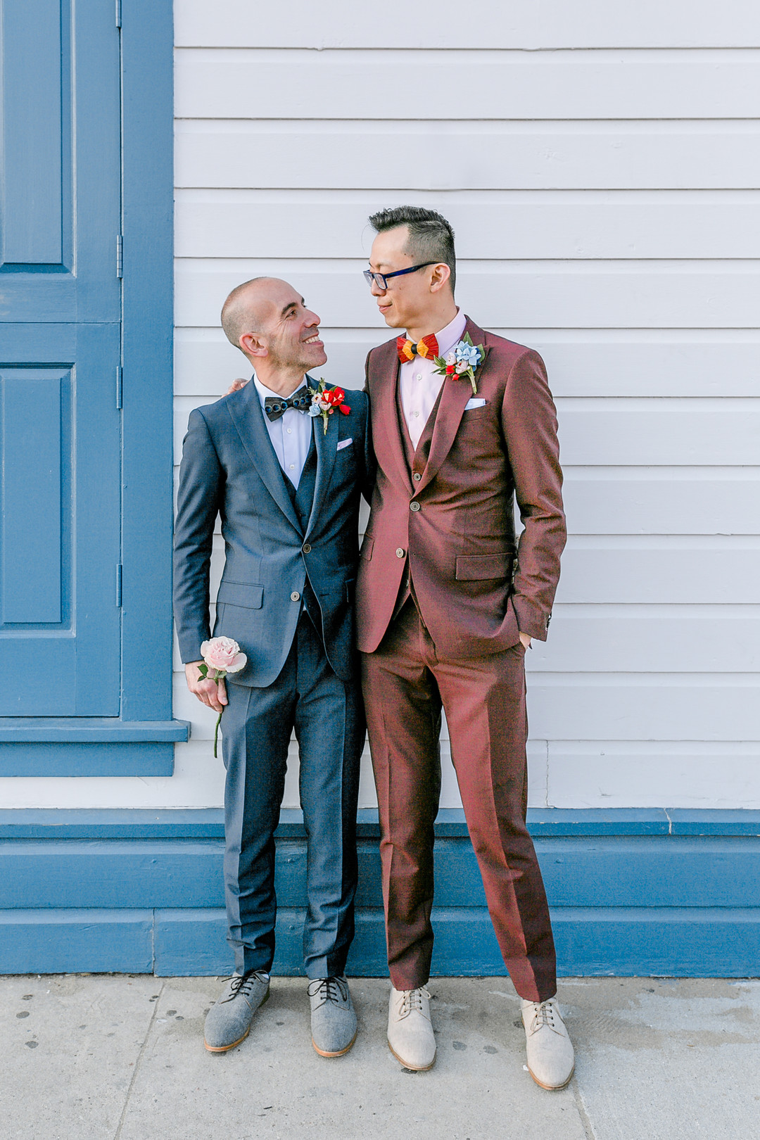 Burgundy and blue spring wedding in San Francisco, California LGBTQ+ weddings two grooms gay wedding Argonaut Hotel bow ties burgundy tux blue tux
