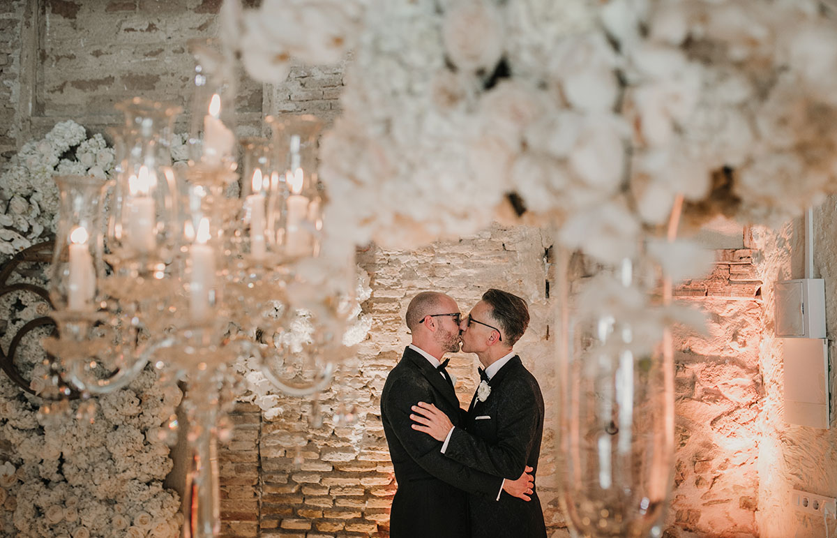 Elegant, romantic intimate wedding in Murcia, Spain LGBTQ+ weddings gay wedding two grooms black tie tuxedos roses flowers blush kiss