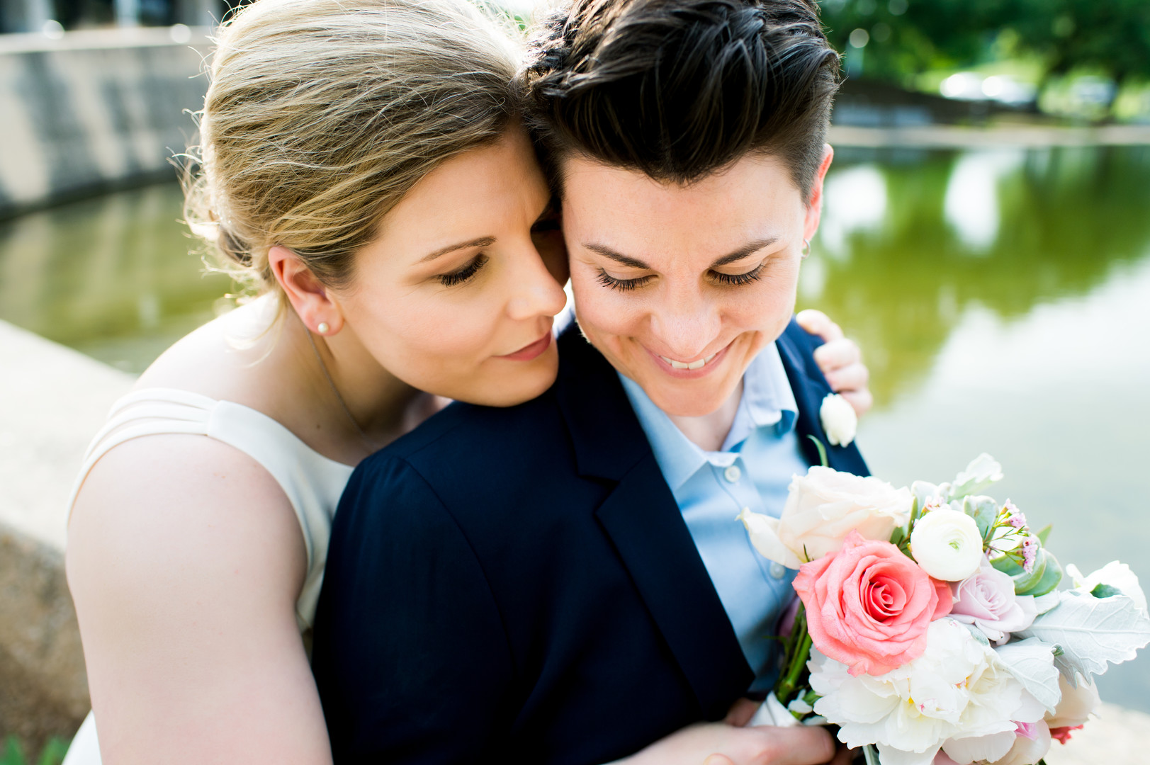 Intimate spring wedding at Butler Park in Austin, Texas LGBTQ+ weddings lesbian wedding two brides white dress navy blue suit