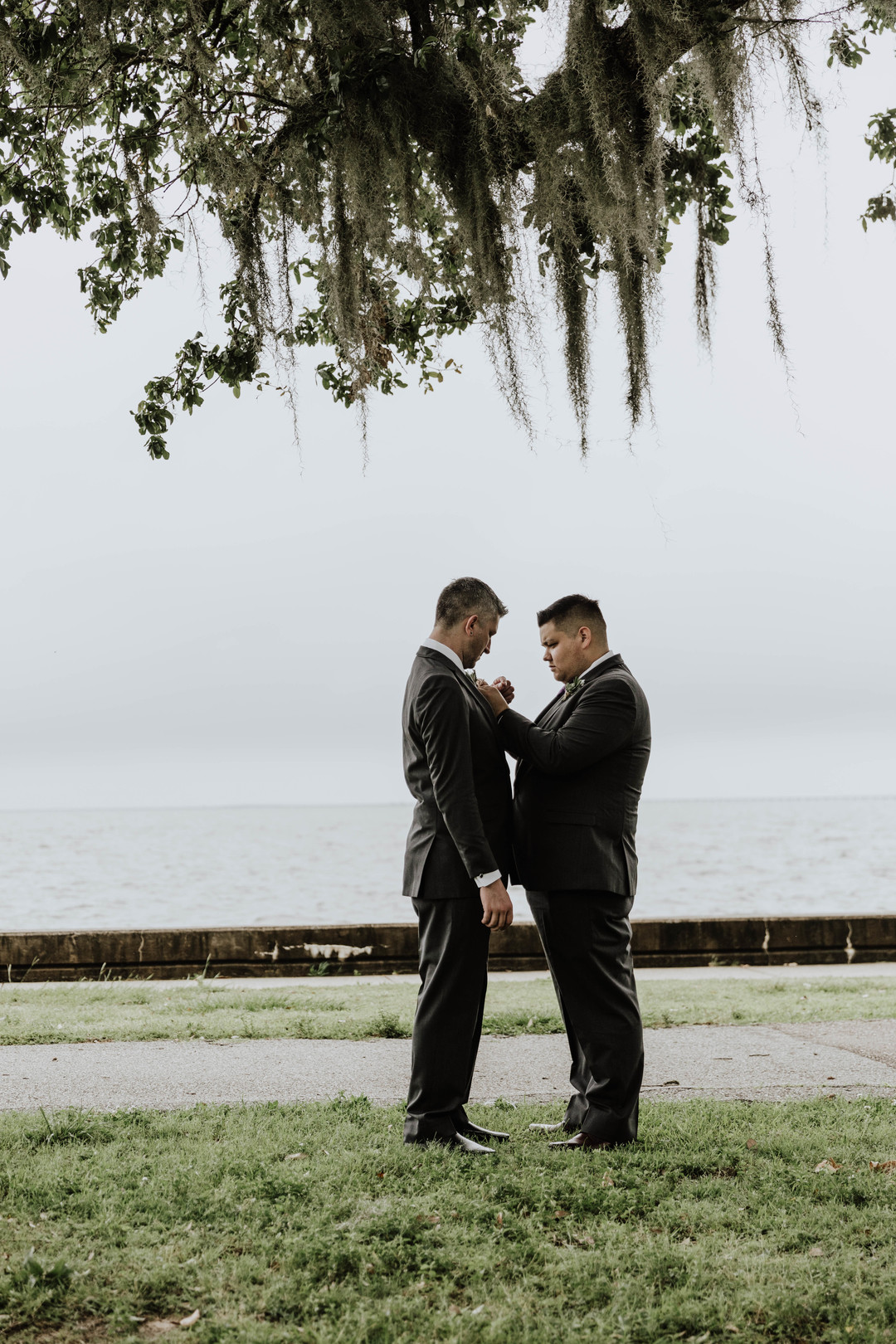 Lakeside historic venue spring wedding in Mandeville, Louisiana two grooms black tuxedos gay wedding