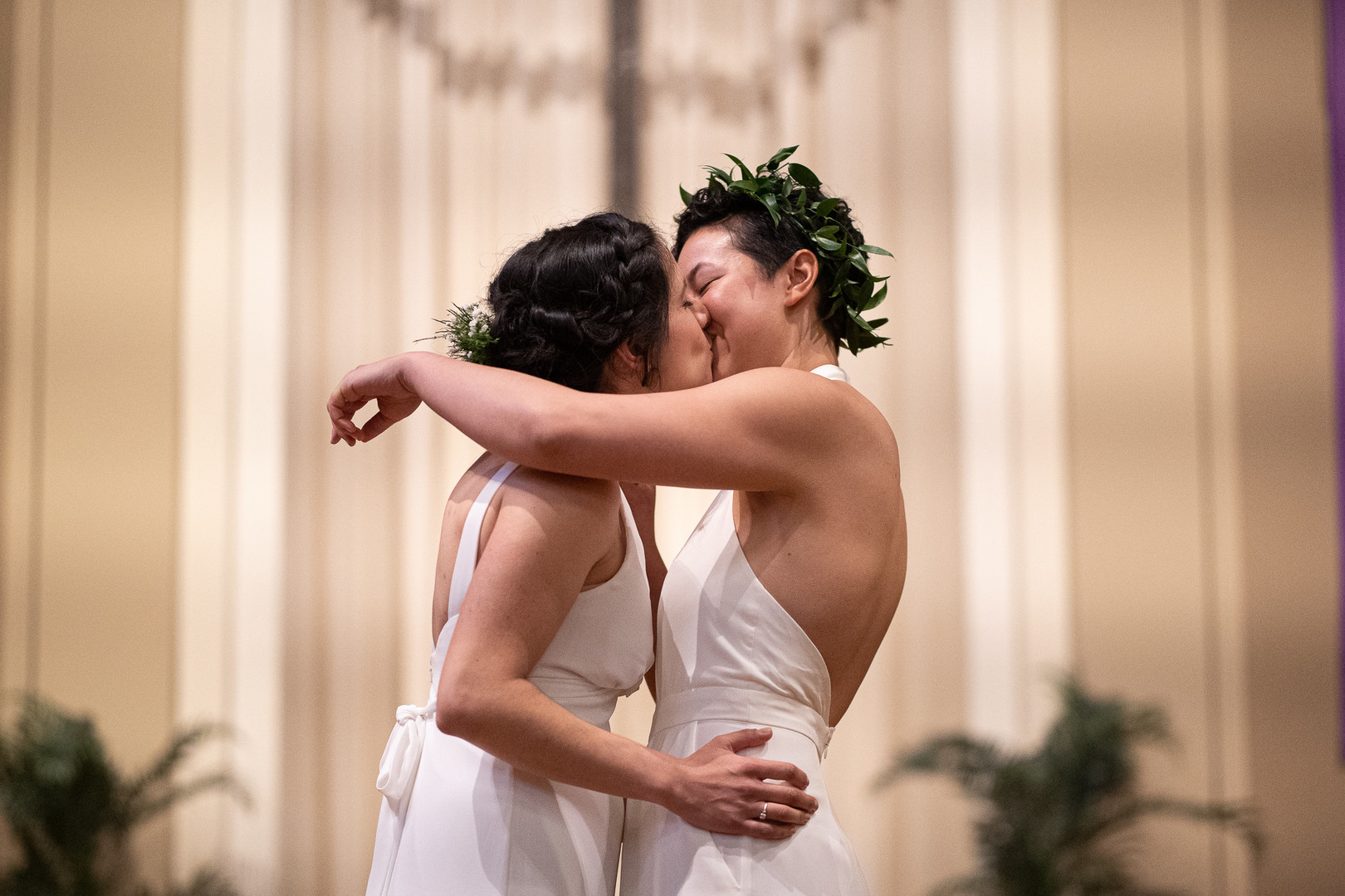 Modern green spring Midwest wedding two brides lesbian same-sex wedding jumpsuit long dress kiss