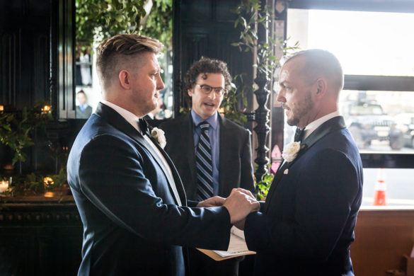 Modern, sophisticated wedding in Washington, D.C. LGBTQ+ weddings two grooms blue tuxedos bow ties elegant luxury vows
