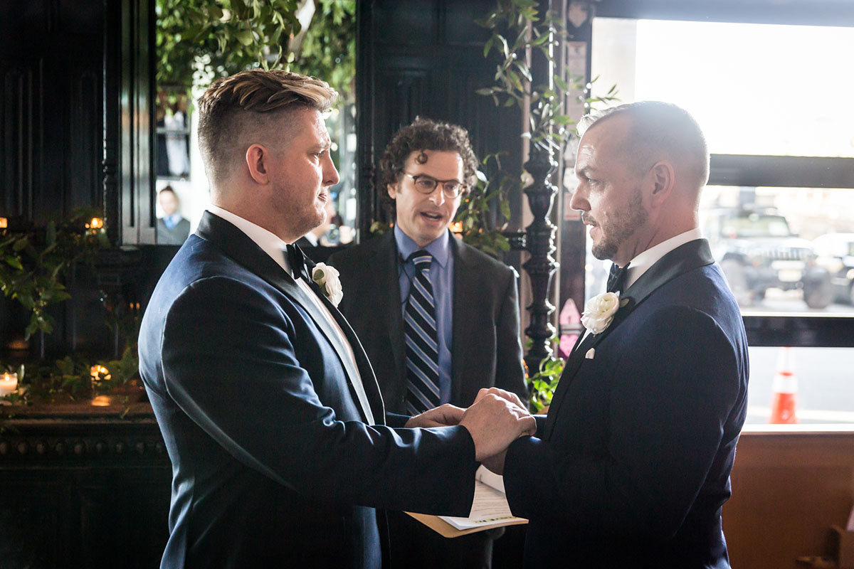 Modern, sophisticated wedding in Washington, D.C. LGBTQ+ weddings two grooms blue tuxedos bow ties elegant luxury vows
