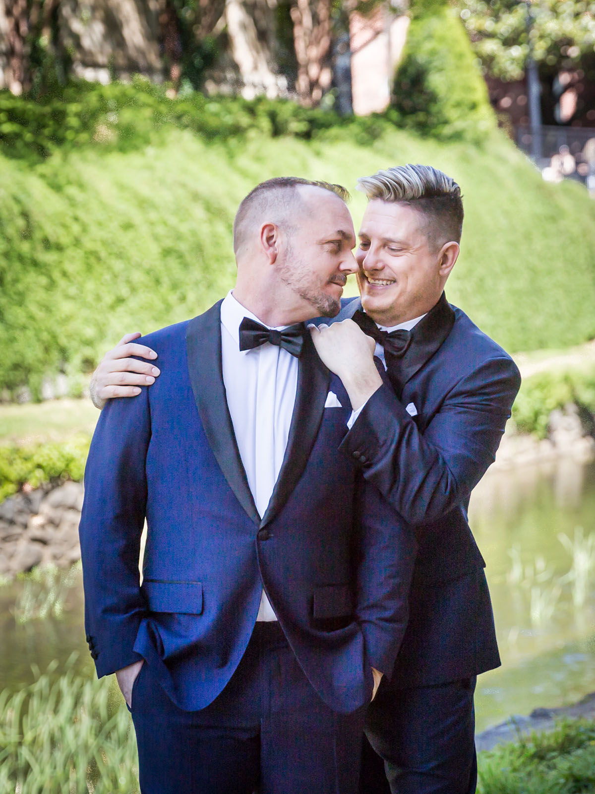 Modern, sophisticated wedding in Washington, D.C. LGBTQ+ weddings two grooms blue tuxedos bow ties elegant luxury