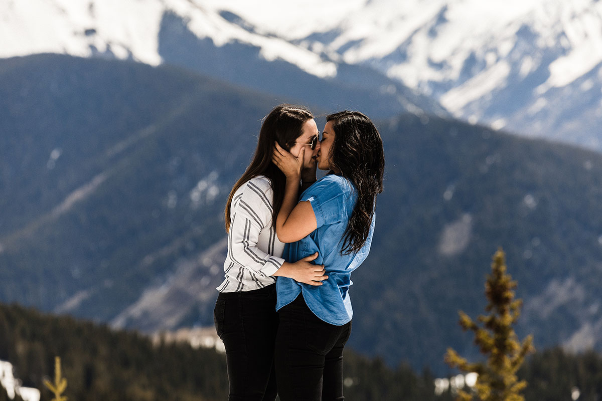 Mountaintop proposal on Aspen Mountain in Aspen, Colorado LGBTQ+ weddings proposal engagement same-sex proposal LGBTQ+ proposal Elk Mountain Range snowy mountains