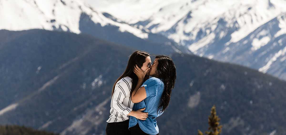 Mountaintop proposal on Aspen Mountain in Aspen, Colorado LGBTQ+ weddings proposal engagement same-sex proposal LGBTQ+ proposal Elk Mountain Range snowy mountains