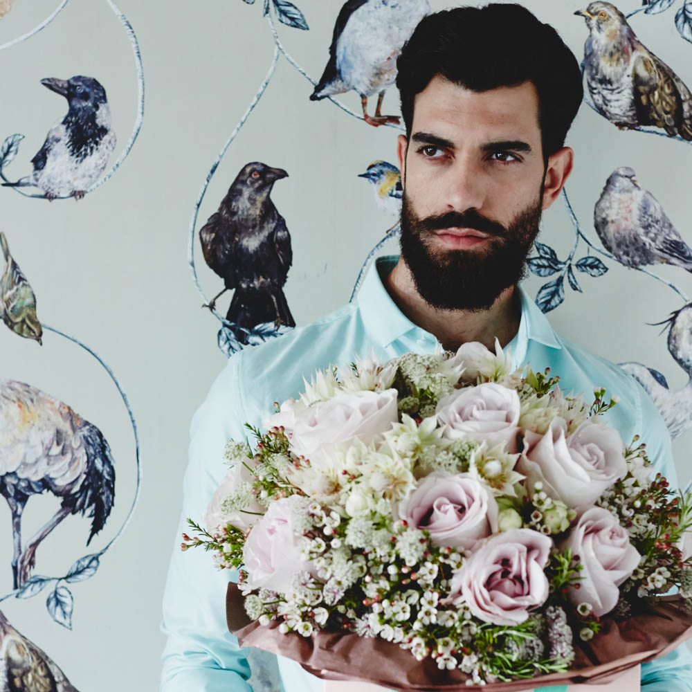 Groom holding a bouquet / Pridelux, a luxury LGBTQ+ wedding show, opens in London