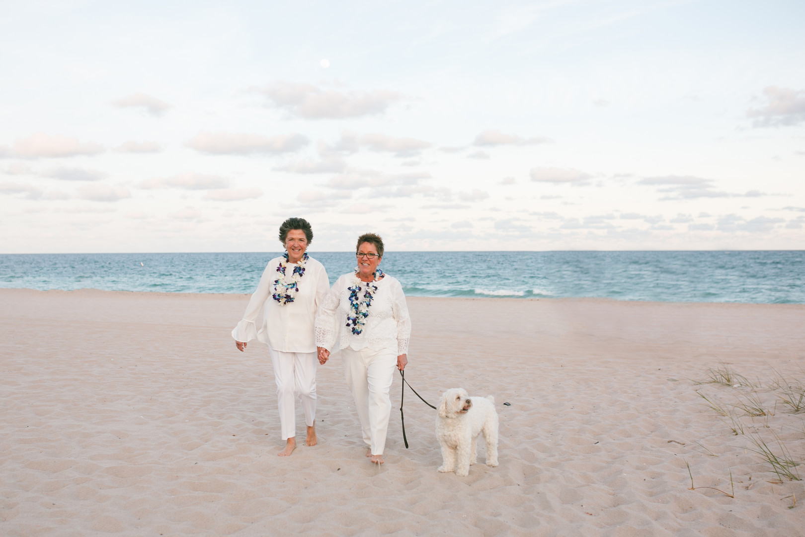 Romantic beach wedding in Fort Lauderdale, Florida two brides lesbian wedding dog