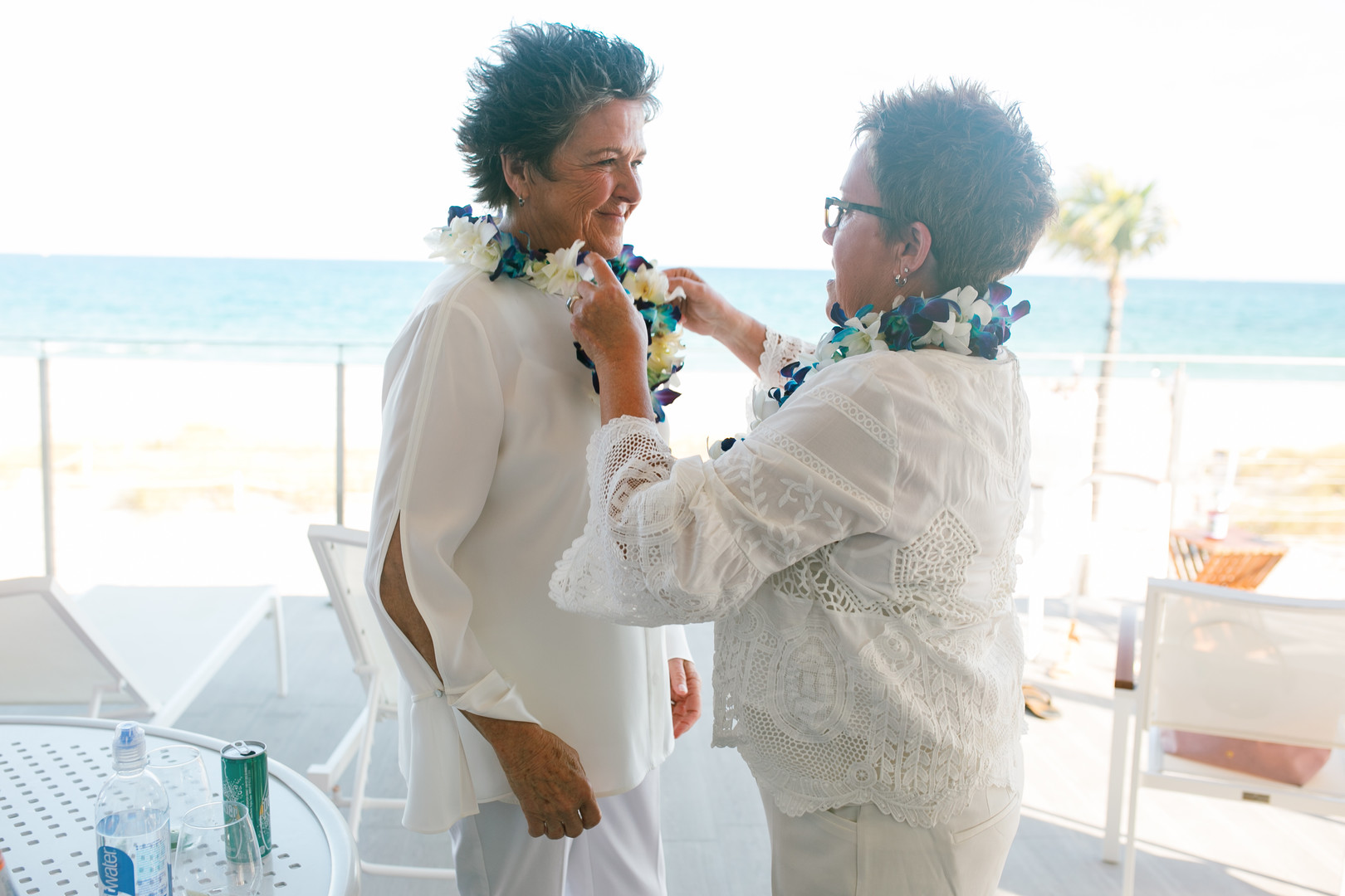 Romantic beach wedding in Fort Lauderdale, Florida two brides lesbian wedding leis
