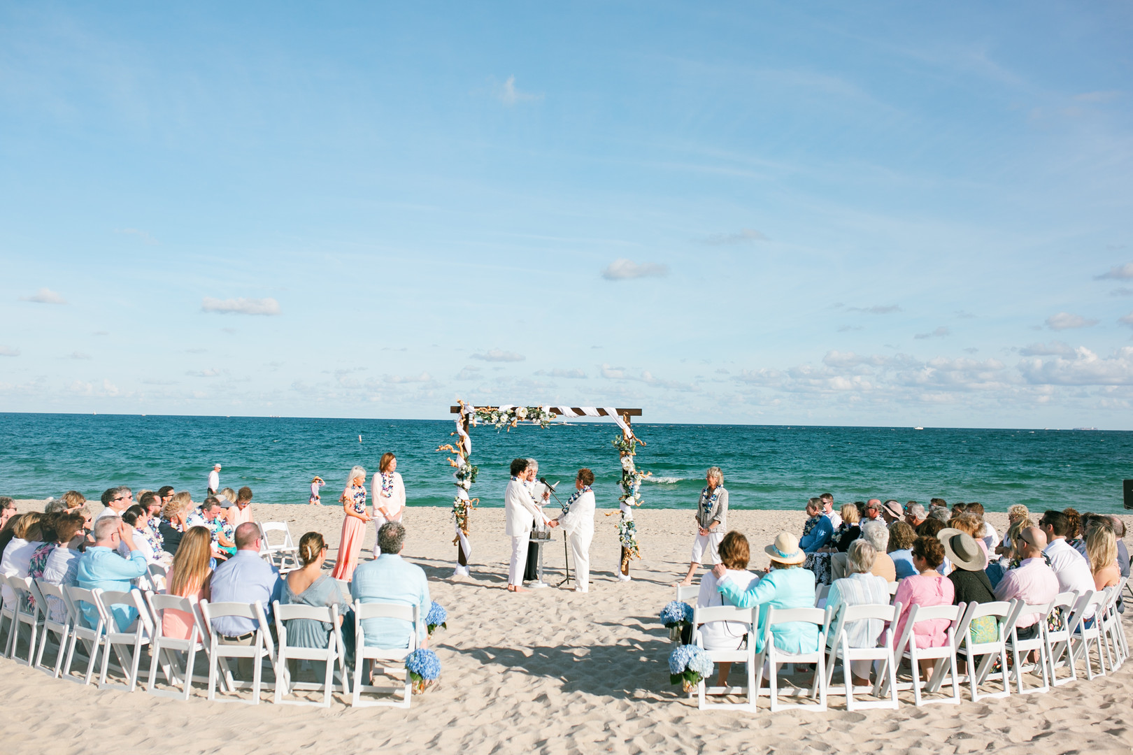 Romantic beach wedding in Fort Lauderdale, Florida two brides lesbian wedding vows