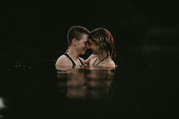 Summer swimming engagement photos in Portland, Oregon lake two brides lesbian engagement photos