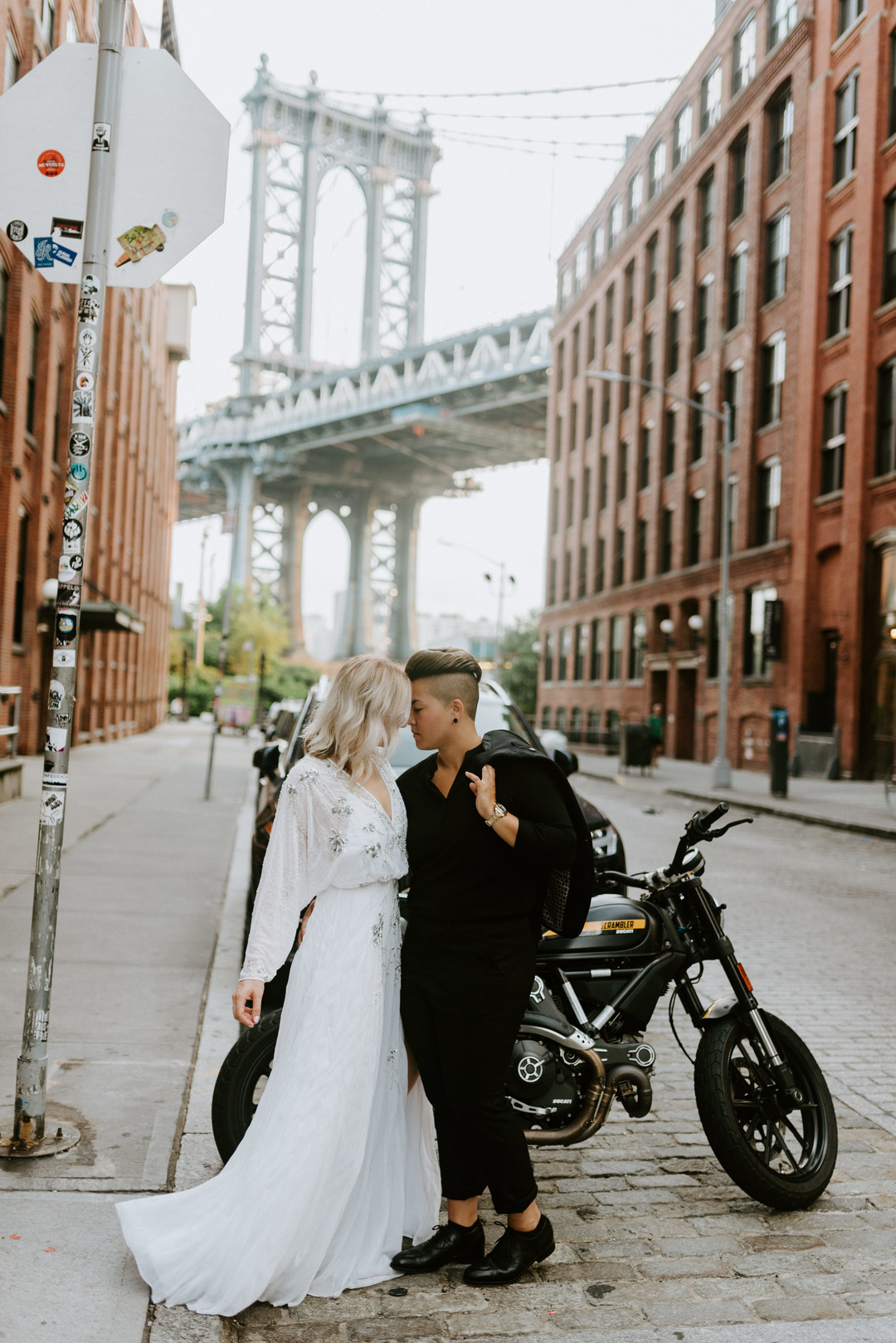 Sunrise engagement photos in Brooklyn, New York LGBTQ+ weddings two brides lesbian engagement long white dress NYC bike