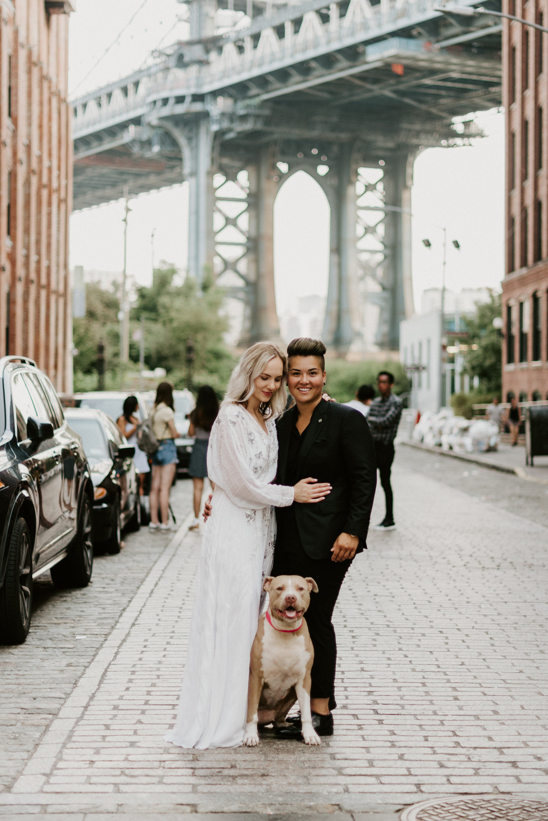 Sunrise engagement photos in Brooklyn, New York LGBTQ+ weddings two brides lesbian engagement long white dress NYC pitbull