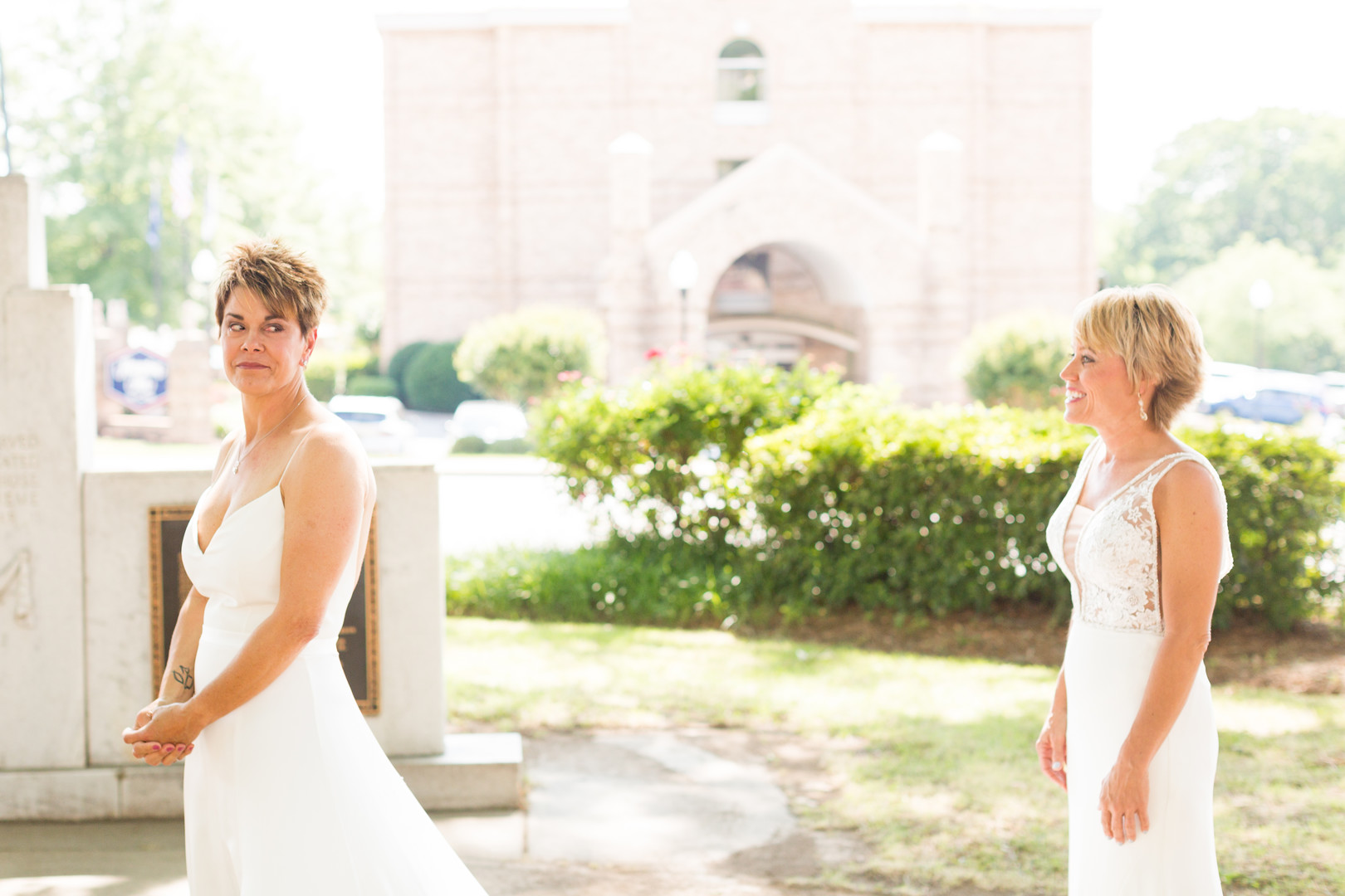 Intimate spring restaurant wedding in Newberry, South Carolina LGBTQ+ weddings two brides white dresses small wedding first look