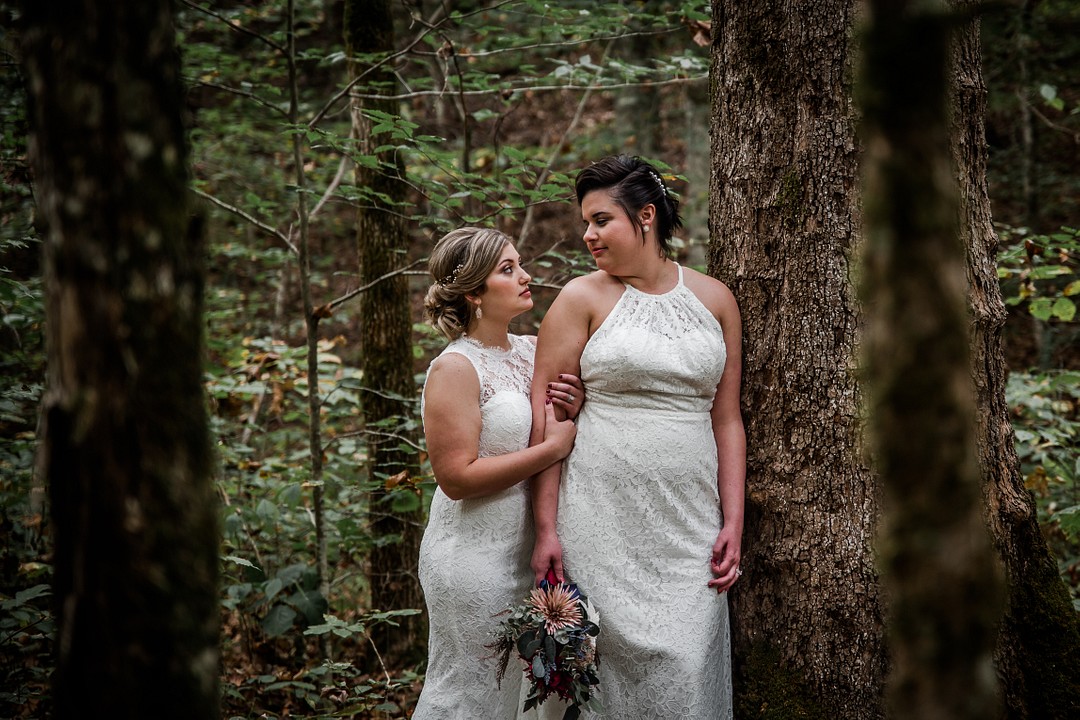 Woodland adventure elopement at Chapel in the Hollow LGBTQ+ weddings two brides waterfall mountains forest woods Tennessee hiking trails