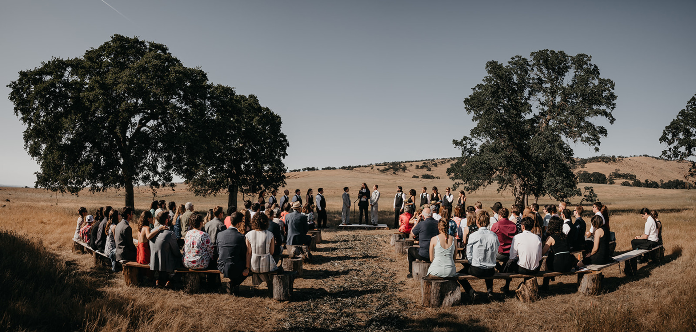 Rustic countryside spring wedding at California Woods Nature Preserve LGBTQ+ weddings gay wedding two grooms moody photojournalist nature vows ceremony