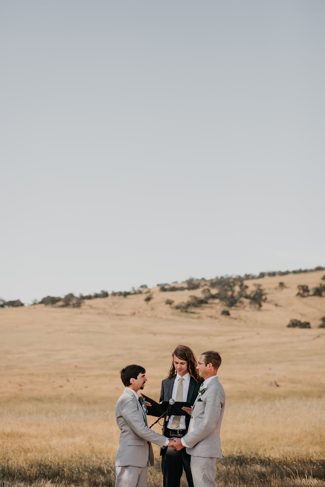Rustic countryside spring wedding at California Woods Nature Preserve LGBTQ+ weddings gay wedding two grooms moody photojournalist nature vows