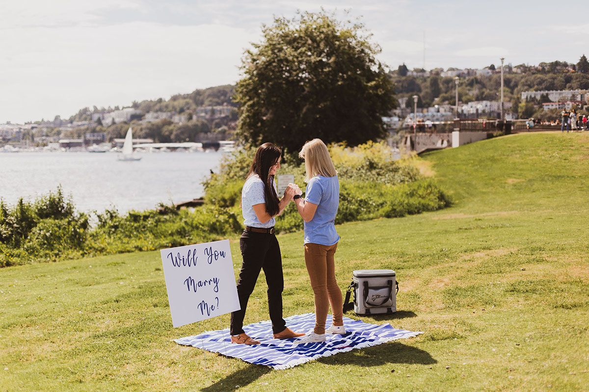 This scavenger hunt at Gas Works Park ends with a proposal LGBTQ+ weddings engagements Seattle Washington two brides picnic