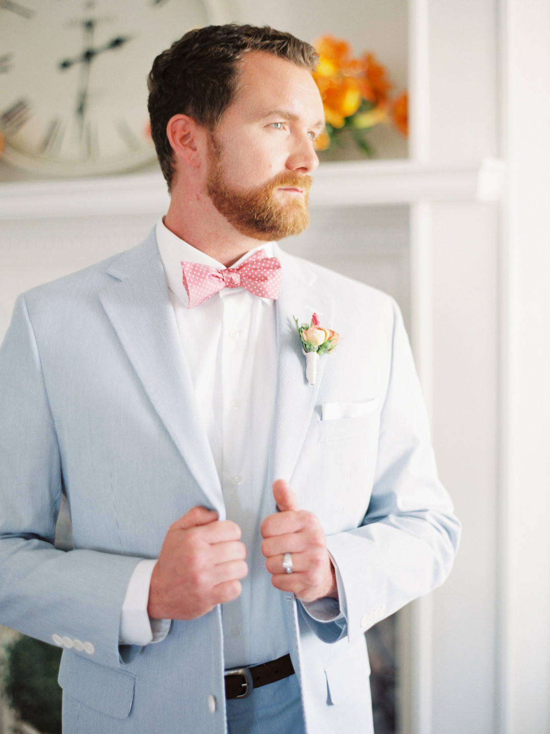 Summer citrus wedding inspiration at historic post office LGBTQ+ weddings two grooms gay wedding blue suit white gray suit orange blue bright colorful summery styled shoot