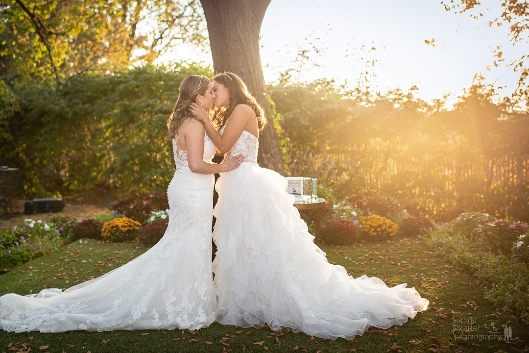 Elegant garden wedding at historic mansion in Hudson, New York LGBTQ+ two brides countryside outdoors sunset lesbian wedding estate kiss