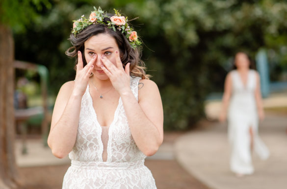 The surprise first look for this spring park elopement will give you the feels LGBTQ+ weddings intimate small lesbian wedding two brides forest park trees outdoor Chattanooga Tennessee first look