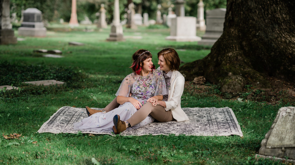 These fall elopement photos in a cemetery are giving us Halloween vibes