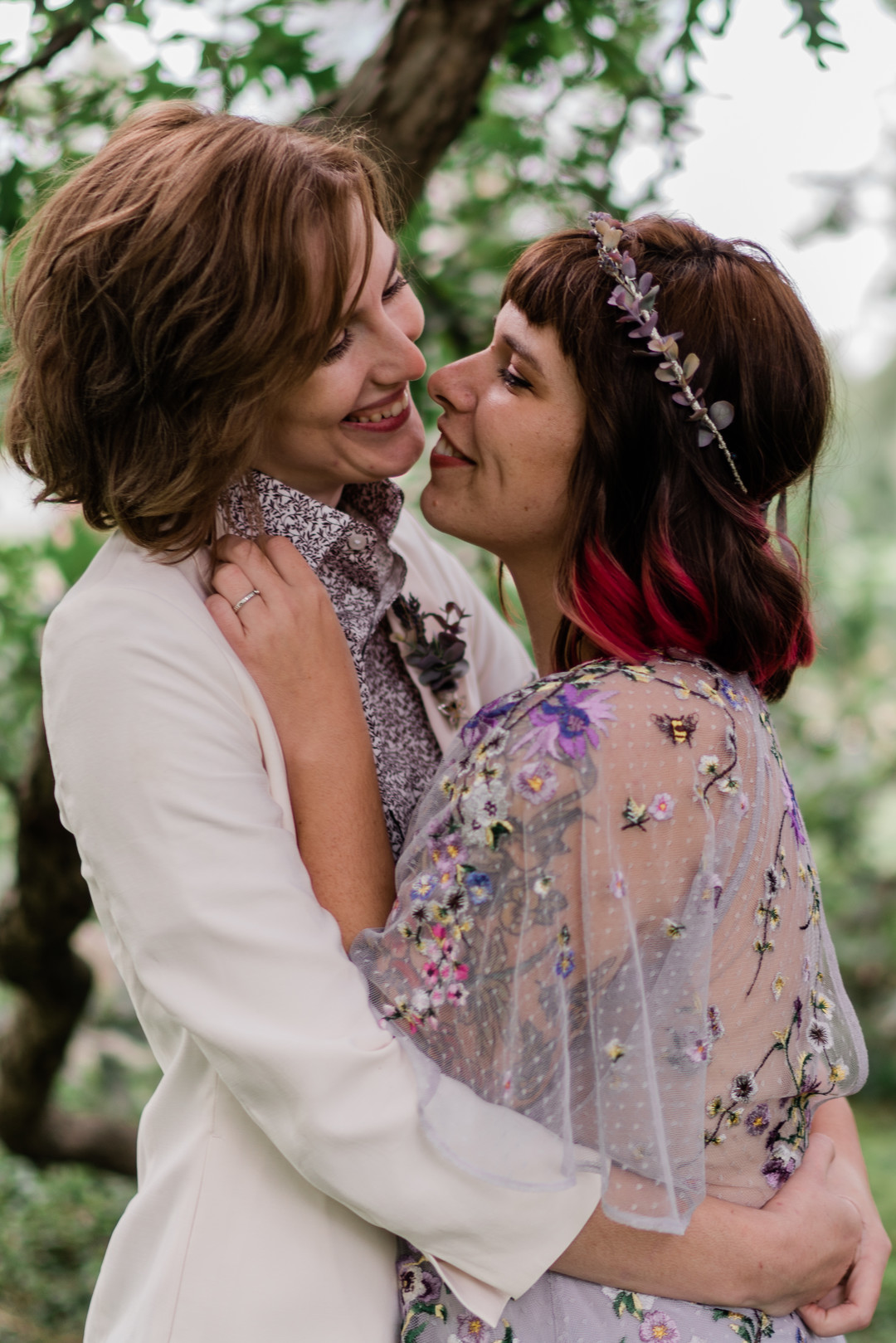These fall elopement photos in a cemetery are giving us Halloween vibes LGBTQ+ weddings two brides pre-elopement photos moody romantic fairy tale old trees outdoor