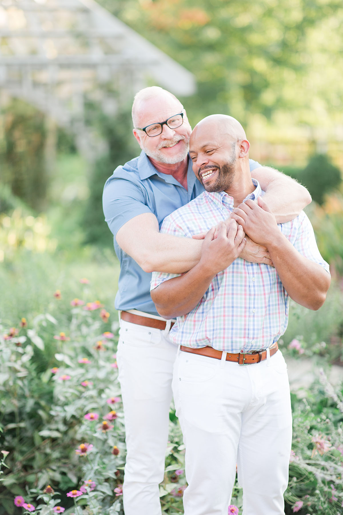 Garden engagement photos at the Franklin Park Conservatory LGBTQ+ weddings two grooms engagement gay outdoors nature