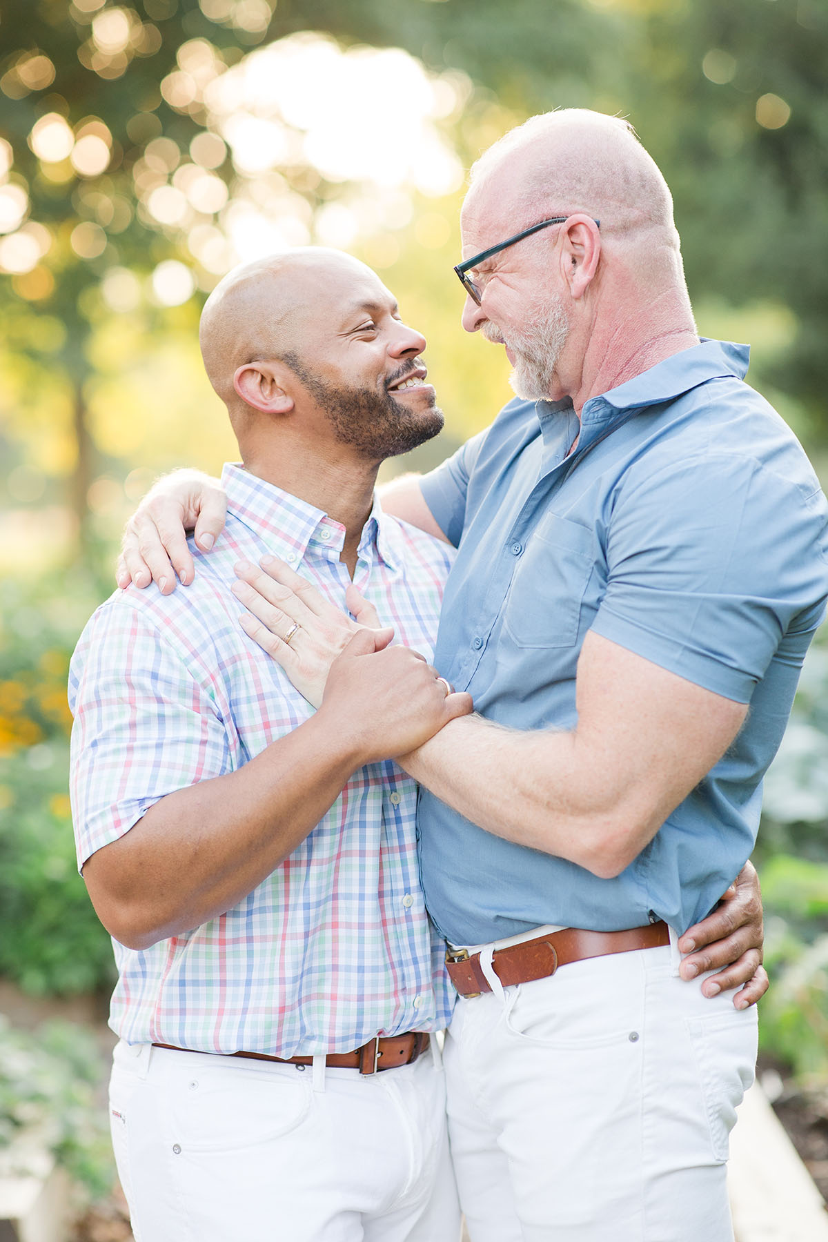 Garden engagement photos at the Franklin Park Conservatory LGBTQ+ weddings two grooms engagement gay outdoors nature