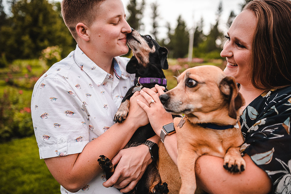 This couples' portrait session turned into the sweetest surprise proposal LGBTQ+ weddings engagements two brides Duncan Gardens Spokane Washington outdoor park engagement dogs