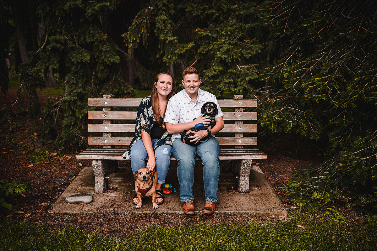 This couples' portrait session turned into the sweetest surprise proposal LGBTQ+ weddings engagements two brides Duncan Gardens Spokane Washington outdoor park engagement dogs