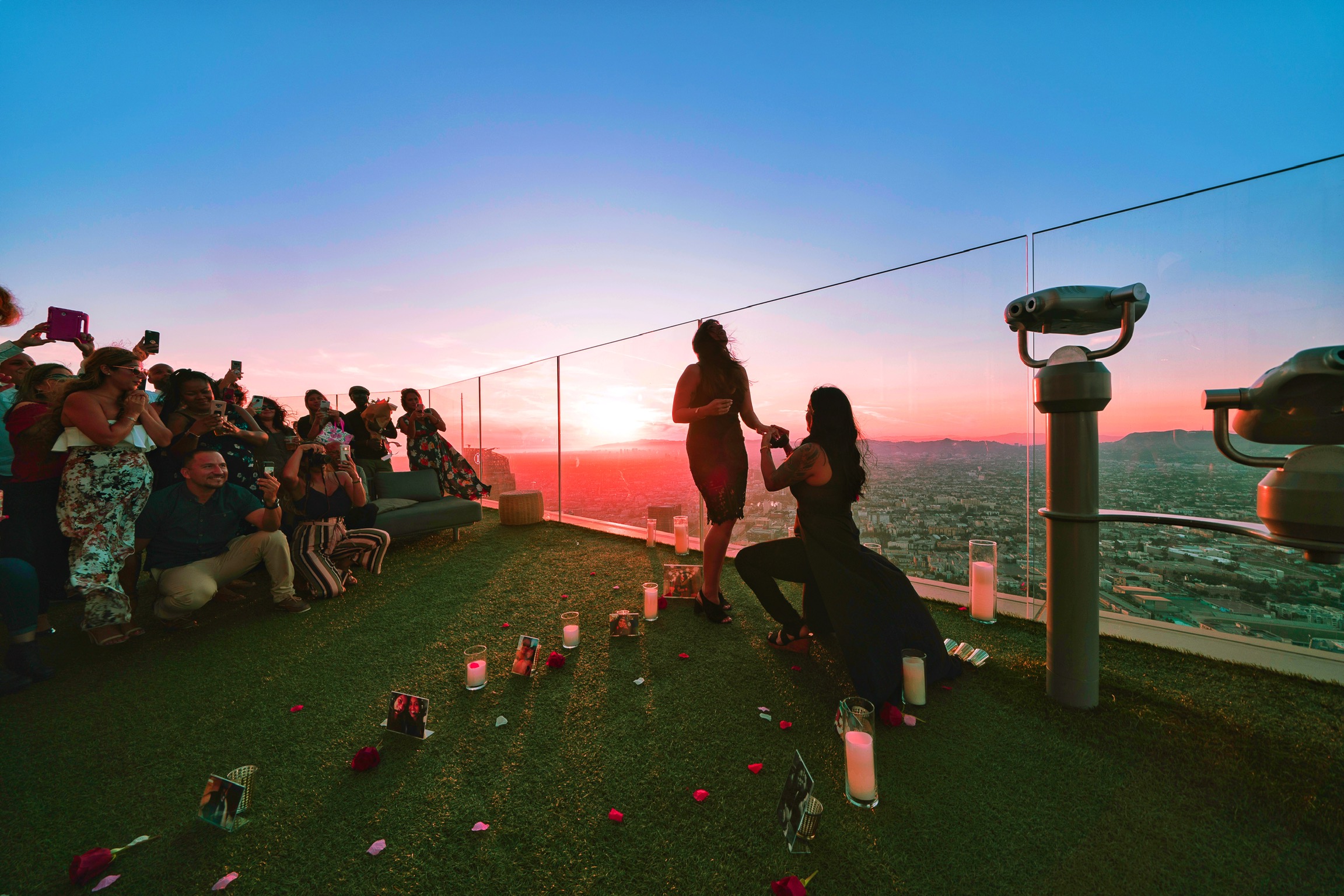 This romantic sunset proposal at OUE Skyspace has a beautiful backstory LGBTQ+ weddings engagements two brides skyline Los Angeles LA California